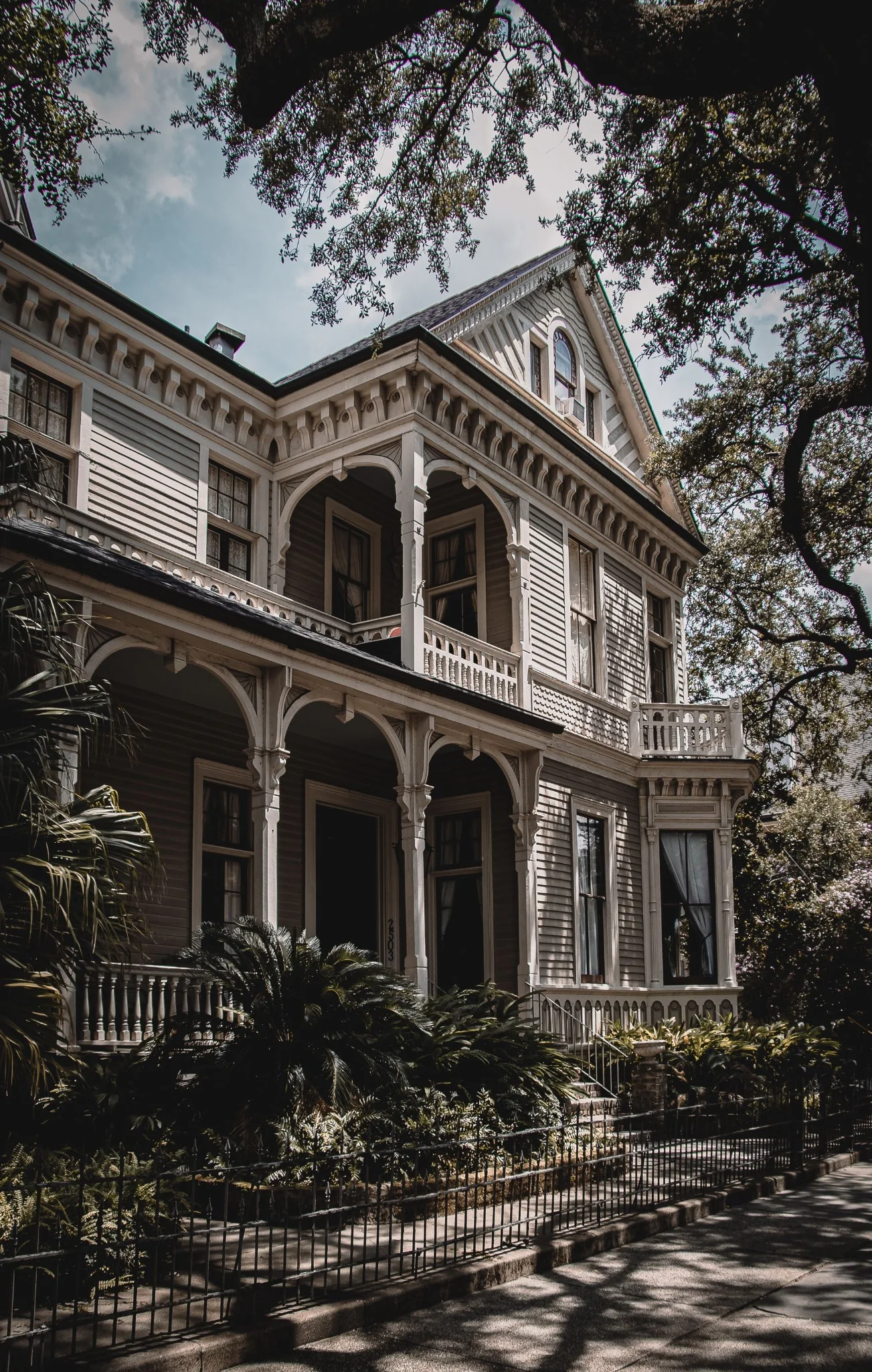 Historic Tampa Bay home shaded by mature trees