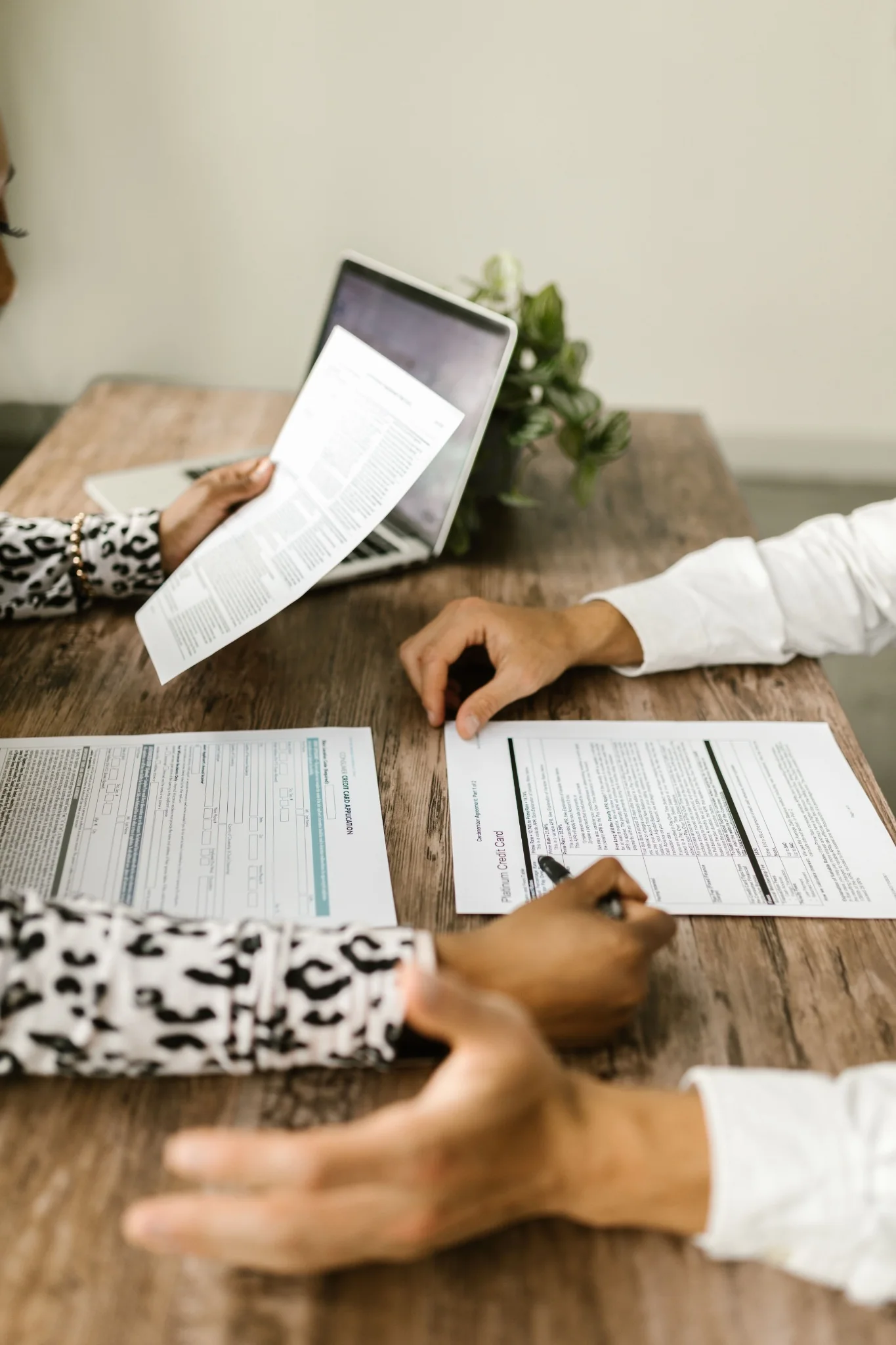 People reviewing insurance paperwork together